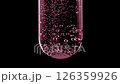 Close up tablet of aspirin, vitamin falls into of water in glass test tube in slow motion on black background. Macro shot of bubbles effervescent. The medicine concept, health care, treatment. 126359926