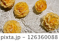 Yellow rose flowers on water surface. Waves, water Splash on white background. Sun and shadows. Pure water with reflections sunlight and shadows in slow motion.  126360088
