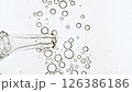 Liquid Fluid Gel or Serum in With Pipette Molecule Bubbles Drips on a White Surface. Dropper for Cosmetic Fluid With Bubbles. Natural Organic Cosmetics, Medicine. 126386186