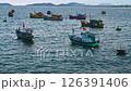 Traditional wooden Vietnamese fishing boats and ships at sea at port in Vietnam 126391406