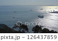 A fleet sailing through the Kanmon Straits early in the morning 126437859
