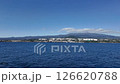 mountain and city skyline seen from the sea 126620788