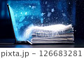 Digital Transformation. Conceptual image of documents transitioning from paper to digital on a laptop. Great for innovation, technology, and automation. 126683281
