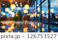 Business background depicting a shopping mall in shallow focus, devoid of people.	 126753527