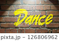 Camera zooms in on spotlight, establishing scene: the word "dance" in graffiti style on brick wall with spray paint effect 126806962