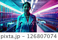 A 42-year-old asian female scientist walks through a vibrant lab as the camera slowly zooms out 126807074