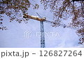 Big construction crane working at construction site outdoor on blue sky background. 126827264