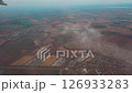 Aerial autumn fields and city of Slovakia, view from flying plane window 126933283