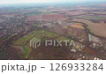 Aerial autumn fields and city of Slovakia, view from flying plane window 126933284