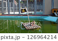 Spot-billed ducks on a raft 126964214