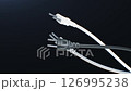 Power Cables Turning on Black Background Loop 3d Animation. Electrical Appliances Plugs and Wires Network Close-up Motion. Electric and Electronics Equipment Illustration Cords Technology Concept 126995238