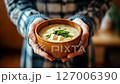 Woman's hand holding miso soup. Japanese food. Stock footage. 127006390