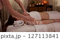 Experience a Relaxing and Rejuvenating Massage Therapy Session within a Calm Spa Setting 127113841