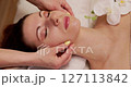 Experience a relaxing and rejuvenating facial massage session that promotes overall wellbeing 127113842