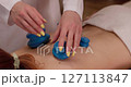 Enjoy therapeutic heat treatment with blue stones at our spa for ultimate relaxation 127113847
