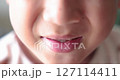 Close up of kid smiling with missing front tooth, child dental care, milk teeth falling out, childhood oral health, happy boy showing tooth gap, first lost tooth, growing up concept. 4K video. 127114411