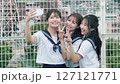 High school girl taking photos on the rooftop 127121771