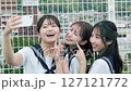 High school girl taking photos on the rooftop 127121772