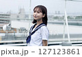 Smiling high school girl standing on the roof 127123861
