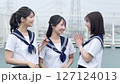 High school girls chatting on the school roof 127124013