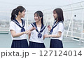High school girls chatting on the school roof 127124014