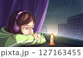 Girl listening to music in wireless headphones while sitting near the window with a burning candle in rainy weather. Lofi animation loop, 4K seamless. 127163455