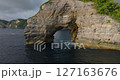 Bali Nusa Penida Banah Cliff Point rock arch aerial drone sea coast sunset 127163676