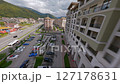 Urban street with alpine-style buildings 127178631