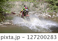 Motorcyclist Crosses Forest River. Slow Motion 127200283