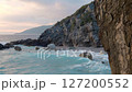 Splashes of Surf on the Evening Seashore. Slow Motion 127200552
