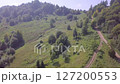 Motorcycle Ride Through Green Hills. Aerial View 127200553