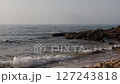 Rocky Shoreline with Gentle Sea Waves Rocky Shoreline with Gentle Sea Waves 127243818