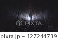 A boy walks through a dark tunnel toward a bright light at the end. An atmosphere of hope, inner strength, and overcoming fear 127244739