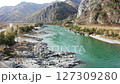 Nature's Stunning Drone View of Amazing Azure Blue Waters Mountain River in Autumn Valley. Aerial shot flying a river flowing in Mountain. Beautiful blue river flowing from Mountains surrounding 127309280