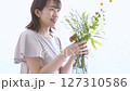 A woman adorning flowers 127310586