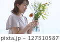 A woman adorning flowers 127310587
