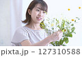 A woman adorning flowers 127310588