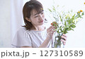 A woman adorning flowers 127310589
