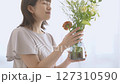 A woman adorning flowers 127310590