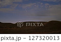 Timelapse Comet Atlas flies across the night sky and disappears behind the horizon of hills. NOV2024 127320013