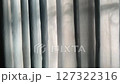 A transparent curtain moving by the wind. 127322316