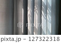 A transparent curtain moving by the wind. 127322318