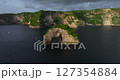 Bali Nusa Penida Banah Cliff Point rock arch aerial drone sea coast sunset 127354884