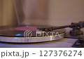 Close-up of vinyl record player needle on spinning turntable surface.  127376274