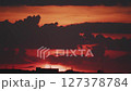 Big sun and a view of the rooftops of the city in real time 127378784
