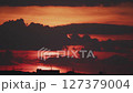 Big sun and a view of the rooftops of the city in real time 127379004