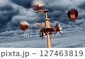 An anemometer spinning in the wind against a backdrop of flying thunderclouds 127463819