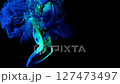Flowing blue particles suspended in a dynamic abstract scene. 127473497