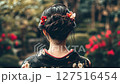 Traditional attire asian adult woman female in floral kimono with intricate hairstyle in garden back view, geisha 127516454