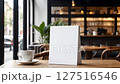 Coffee shop menu white empty mockup sign with blurred background in urban setting 127516546